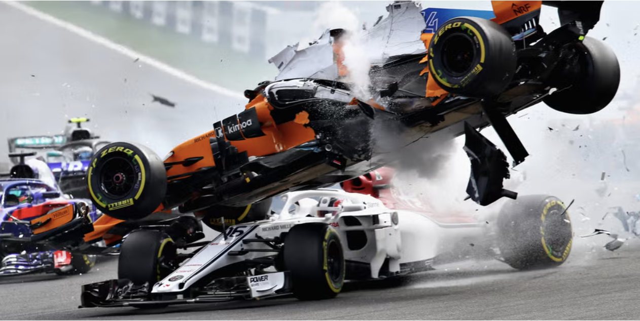 A Formula One car thrown into the air in a first-corner collision
